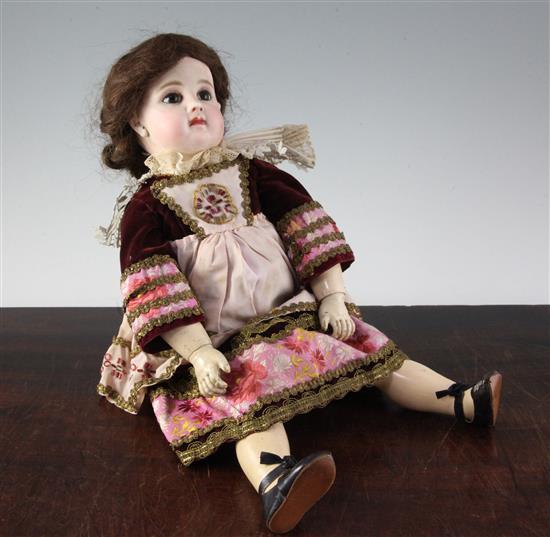 A Jumeau bisque head doll, stamped 7EJ, late 19th century, height 17.5in., small firing crack to right ear
